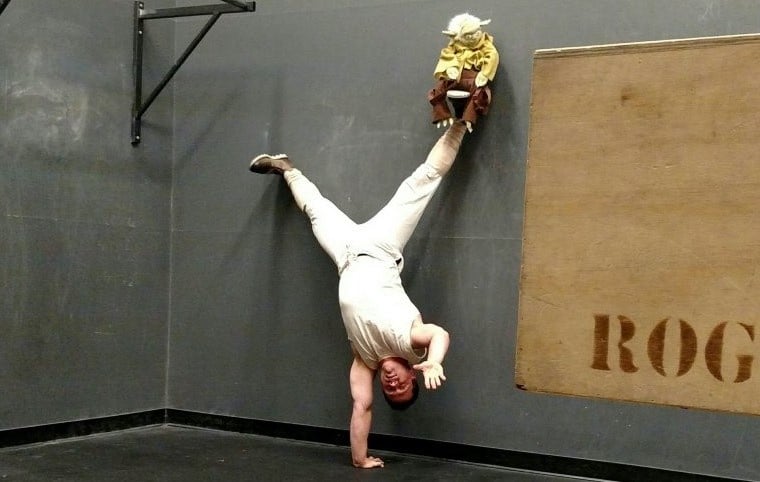 Jim pretending like he's Luke doing a handstand.
